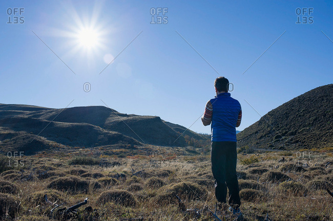 Man standing in a field in Patagonia