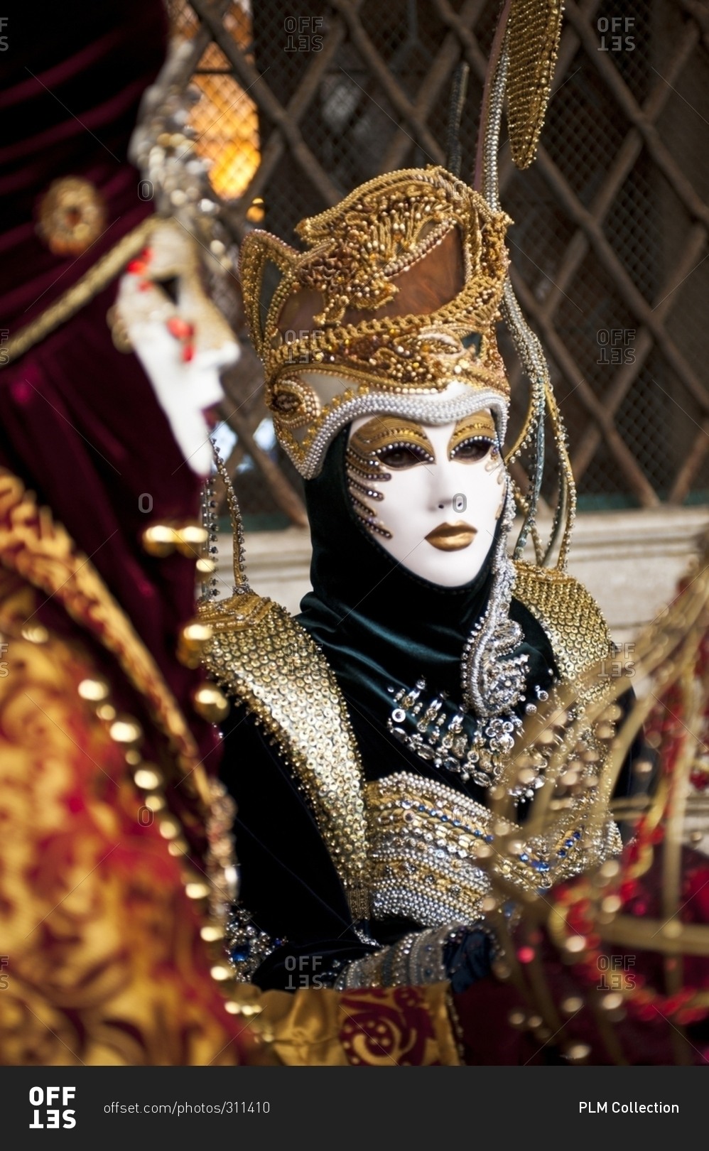 Carnival masks in glittering clothes, Venice, Italy