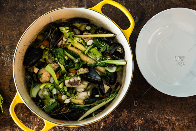 Overhead view of pot of seafood stew
