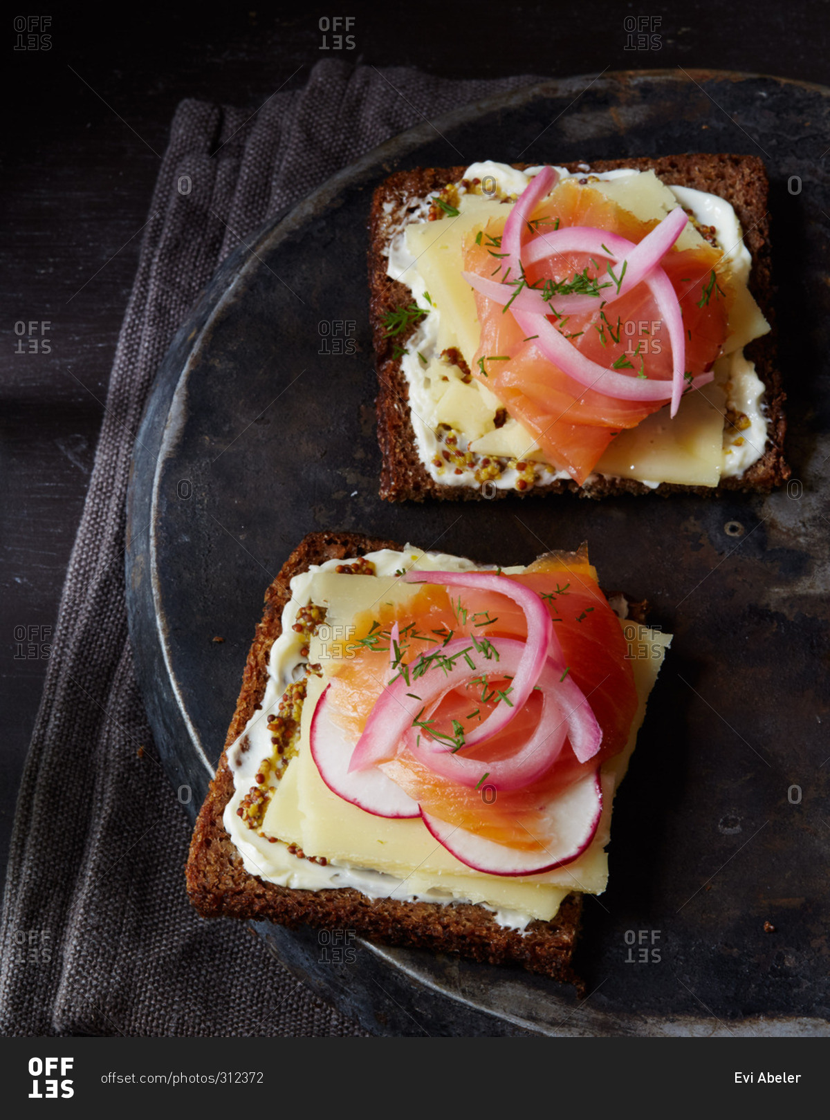 Open-faced sandwich with havarti, radish, pickled onion and salmon