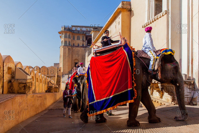 Jaipur, Rajasthan, India -January 7, 2016: Tourists riding elephants at Amer Fort of Jaipur, Rajasthan