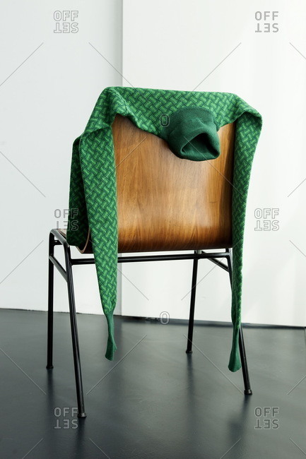 Green sweater on a chair