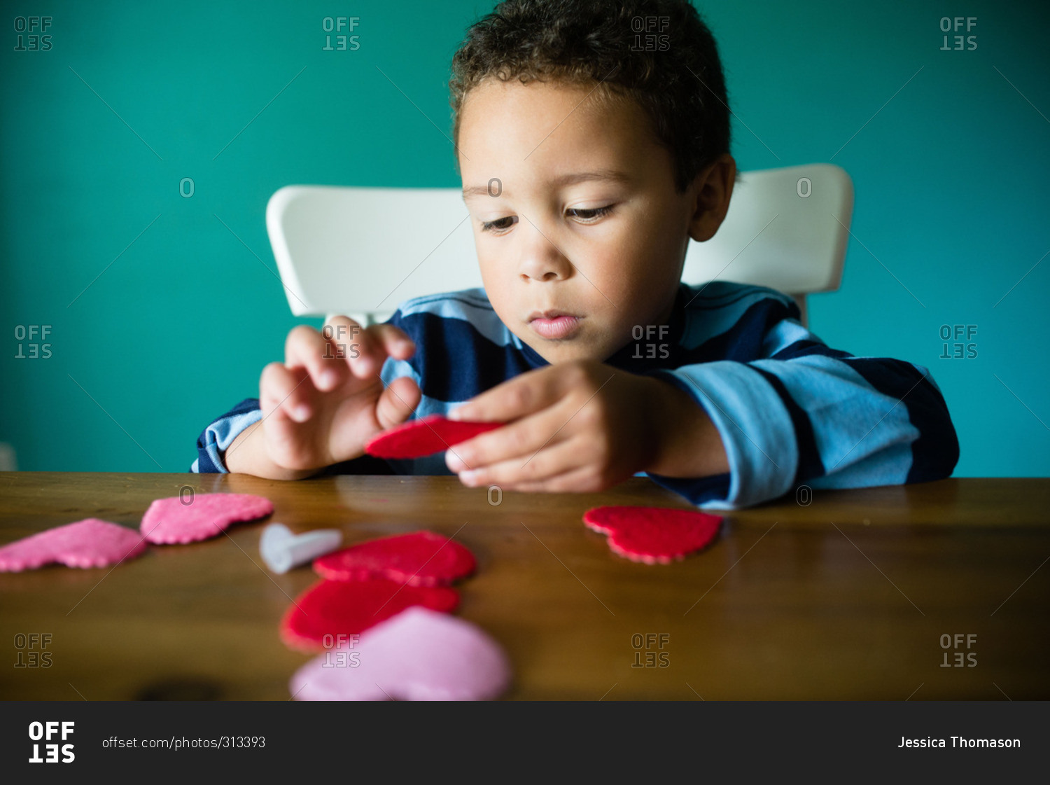 Little boy making a Valentine's Day craft