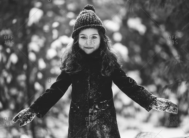 Portrait of a little girl playing outside in winter