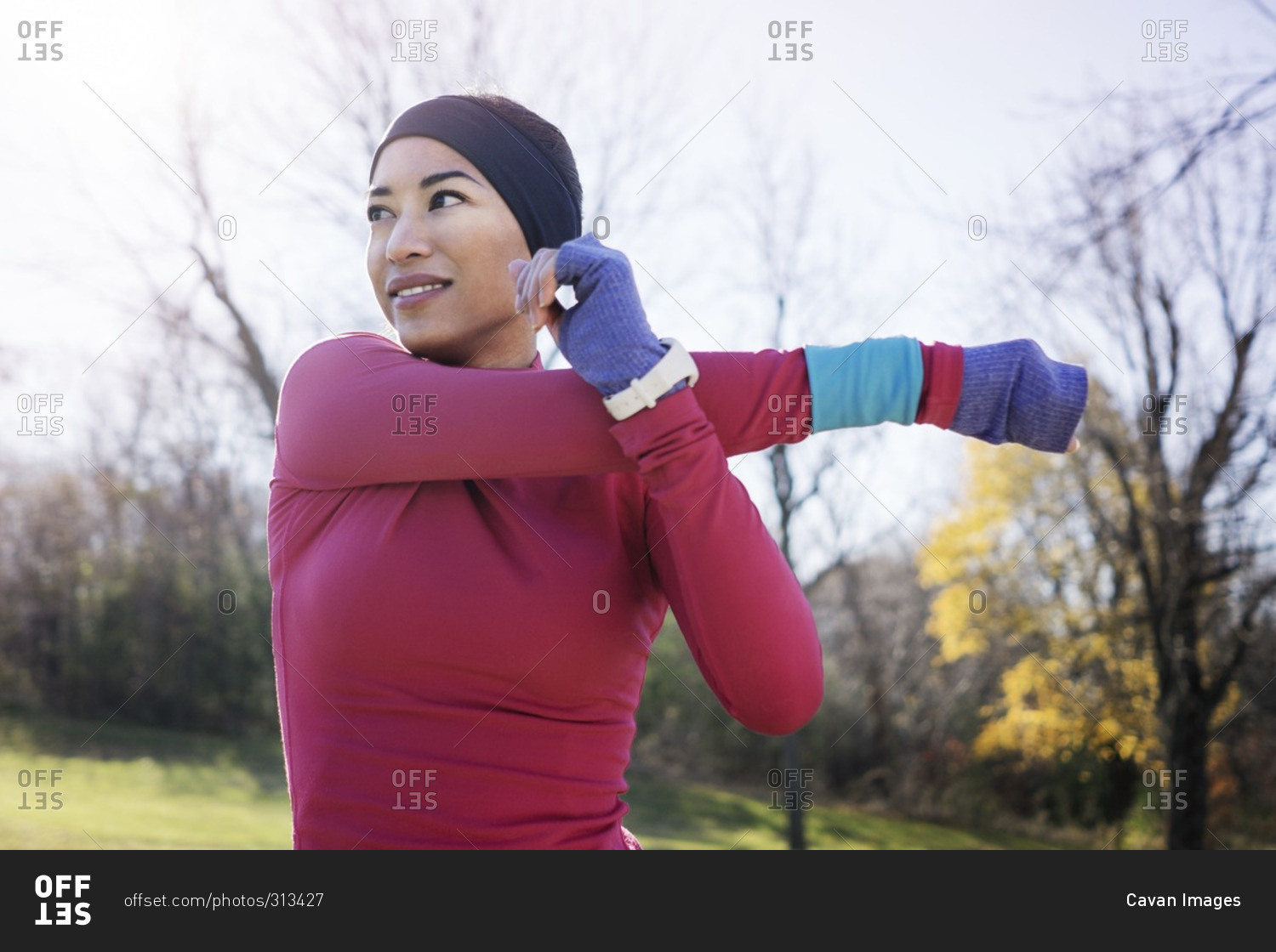 Woman stretching arms before outdoor workout