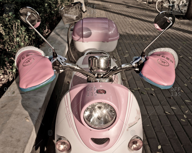 A pink motor scooter in China stock photo - OFFSET