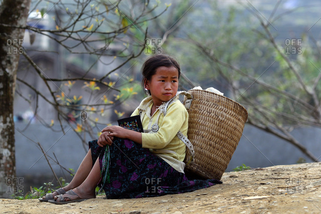 Northern Vietnam - March 16, 2012: A young Black Hmong girl at Lao Cai village near Sapa