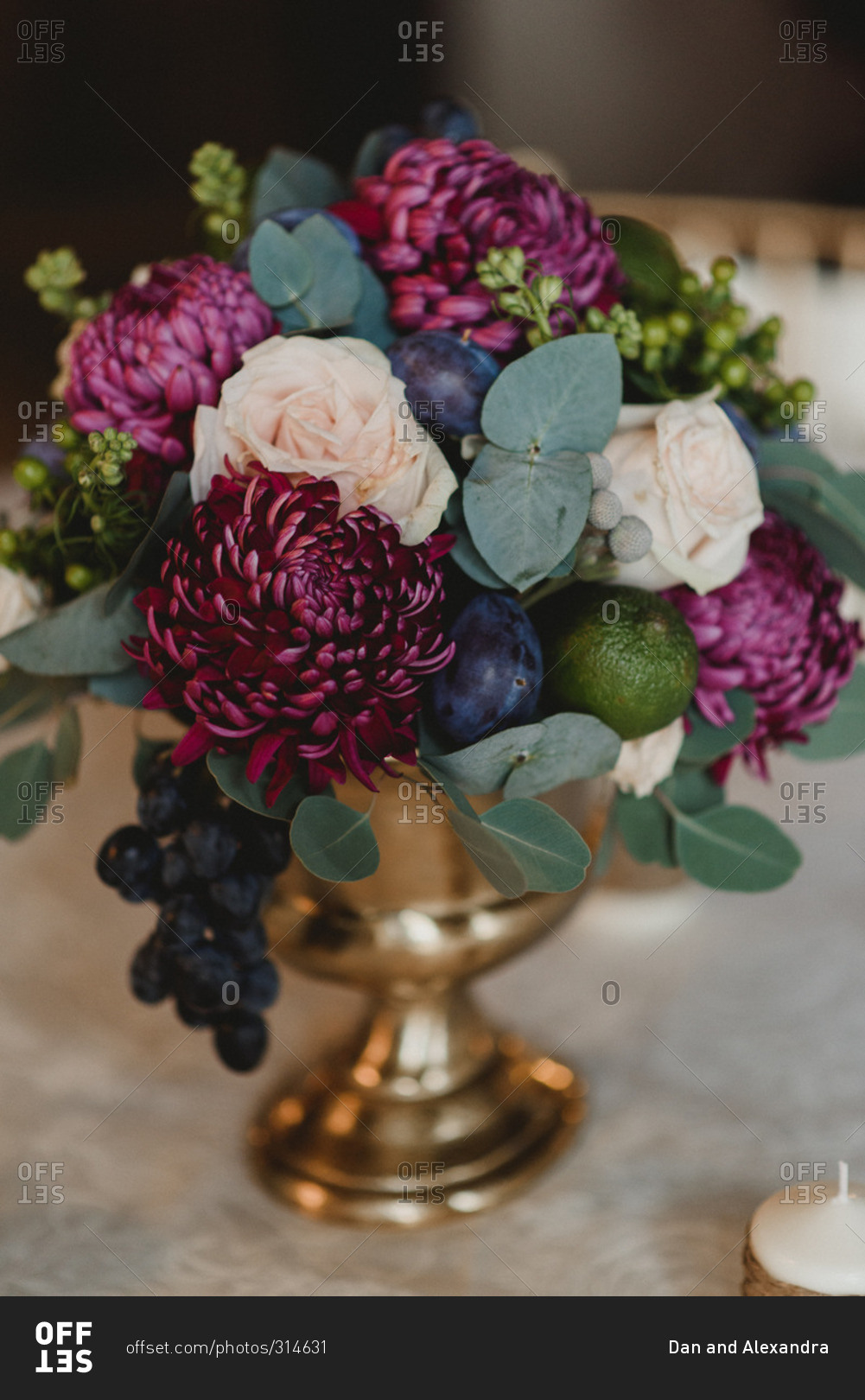 Close up of purple and white floral arrangement at a wedding