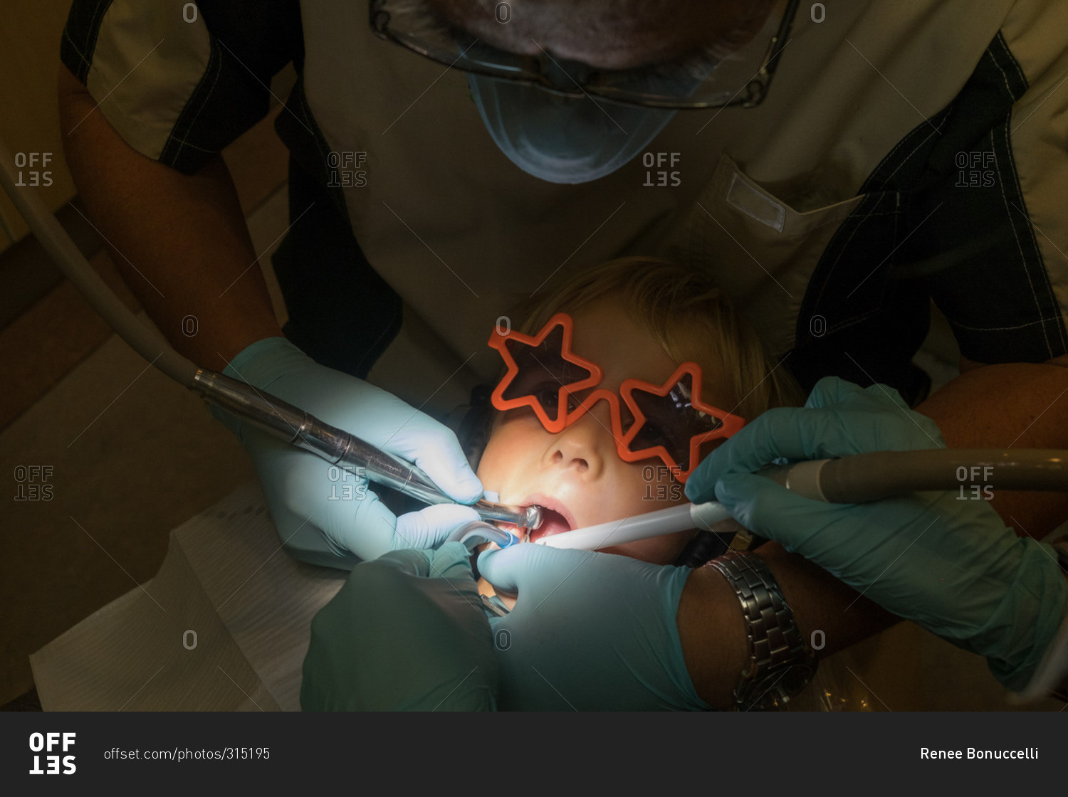 Little boy getting a filling in a dentist office