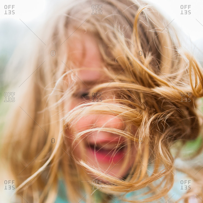 Portrait of a little girl with windblown hair