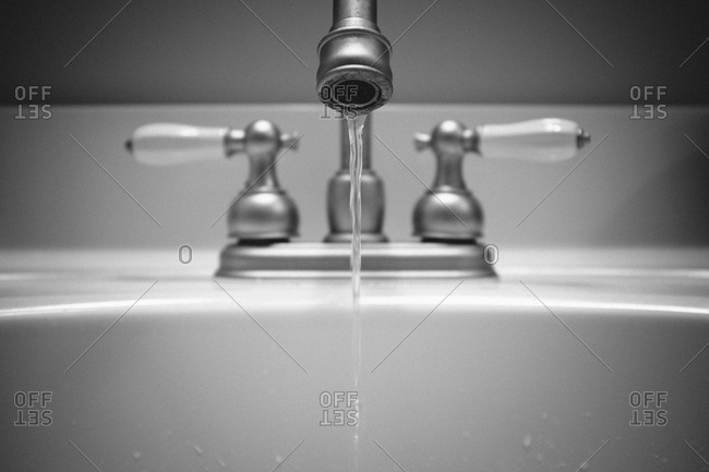 Water Dripping From A Bathroom Sink Faucet Stock Photo Offset