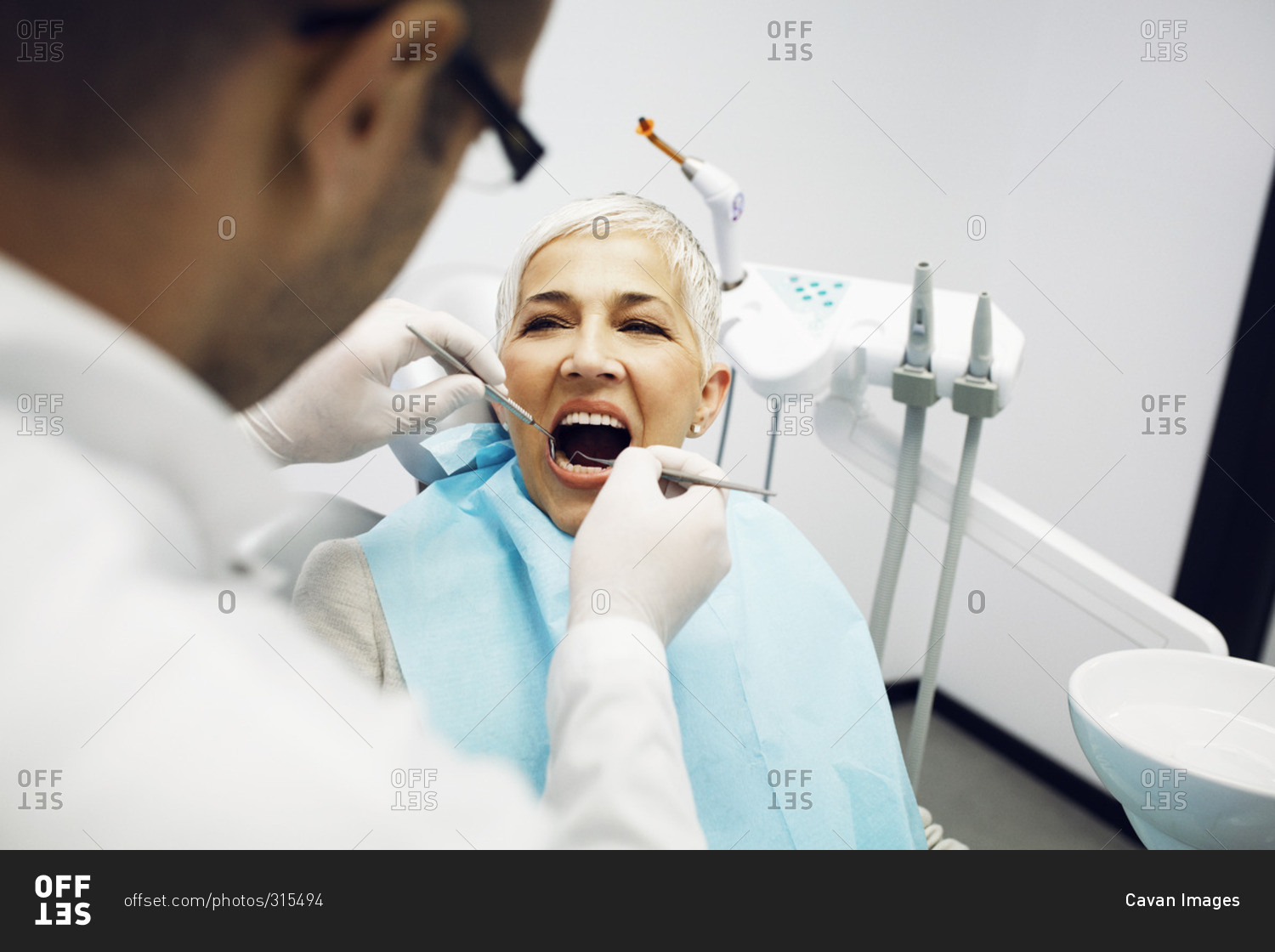 Woman getting a checkup at the dentist