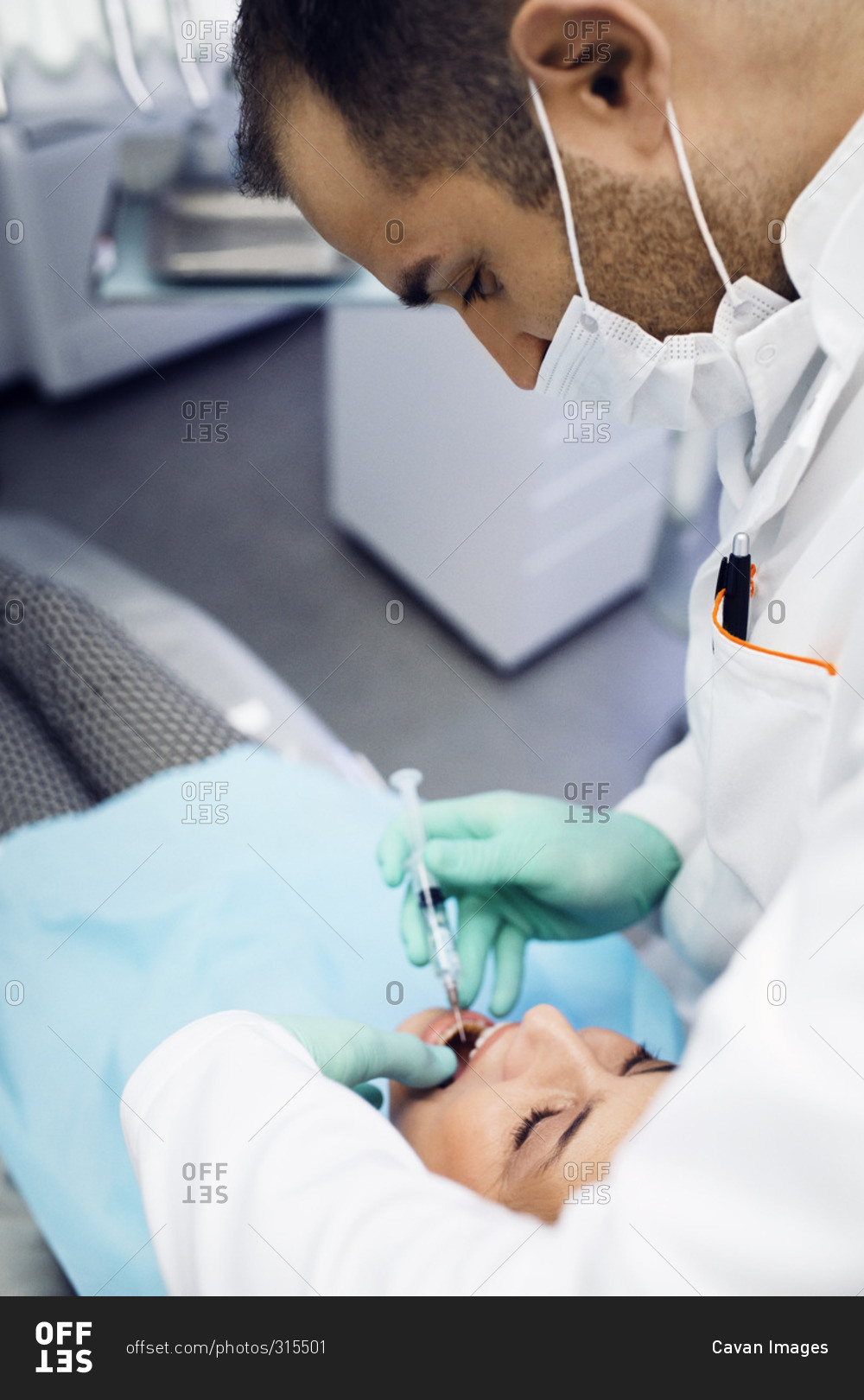 Dentist giving a patient an injection