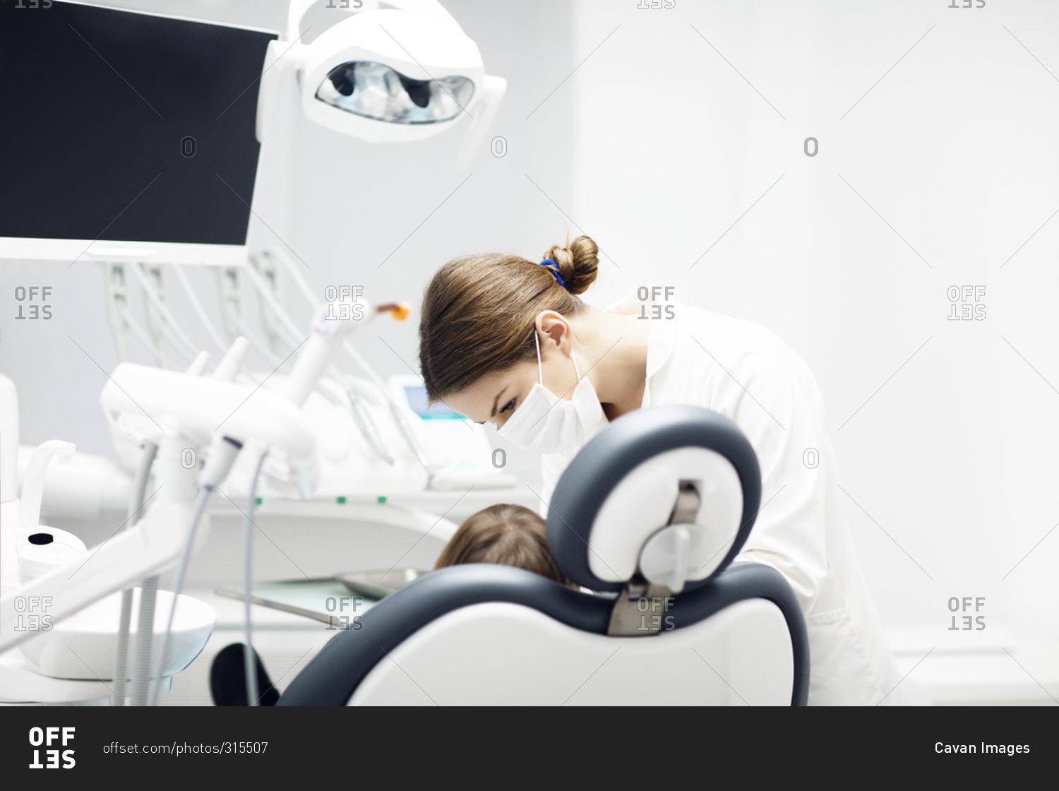 Girl getting a checkup at the dentist
