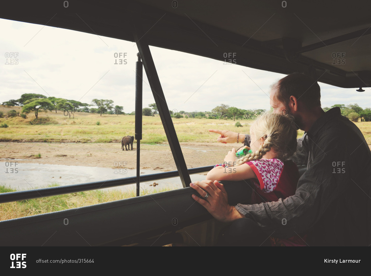 Man and girl on safari tour
