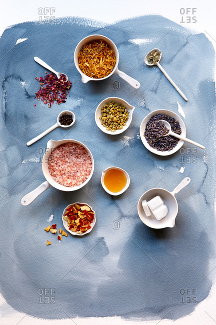 Overhead view of soap making ingredients on a watercolor background