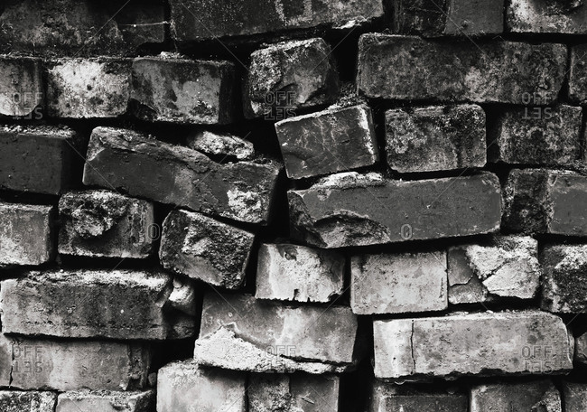 Pile of bricks with cracked and worn edges