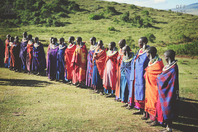 Tanzania - July 15, 2015: A group of Maasai villagers standing together in a circle