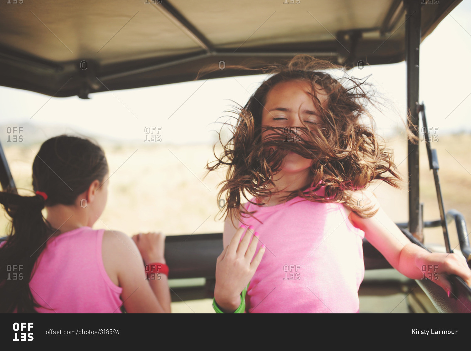 Girl with hair in her face while on safari
