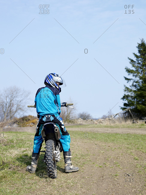 Teenage boy on motorbike Offset stock photo OFFSET