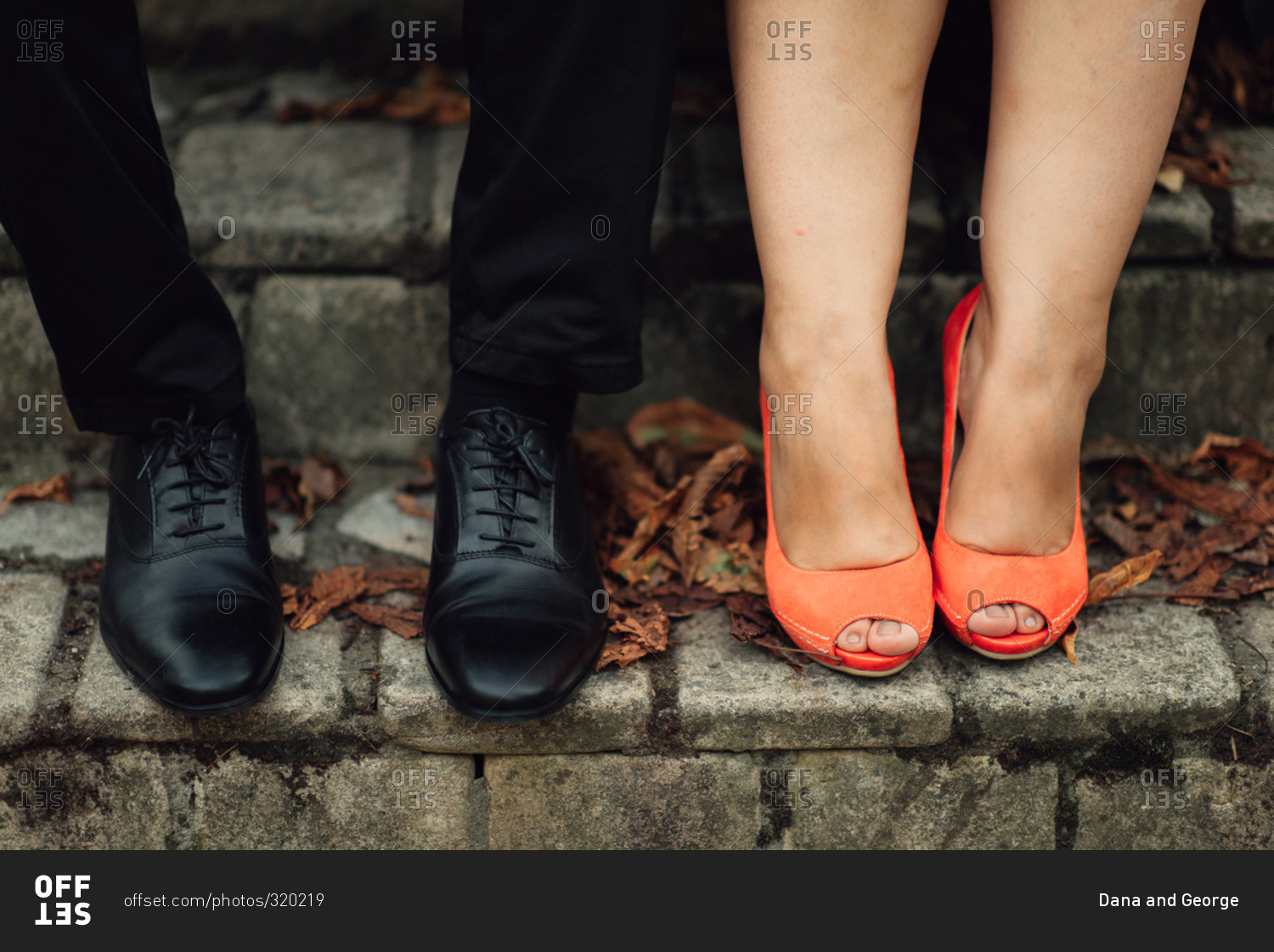 Feet of couple in dress shoes stock 