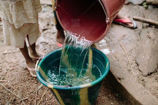 pouring water from bucket