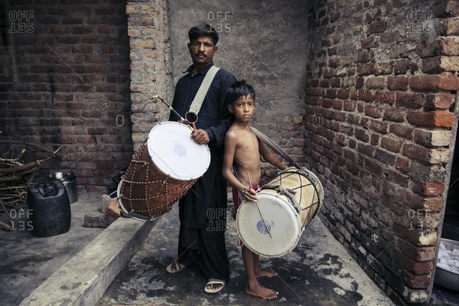 Delhi, India - June 18, 2015: Father and son musician