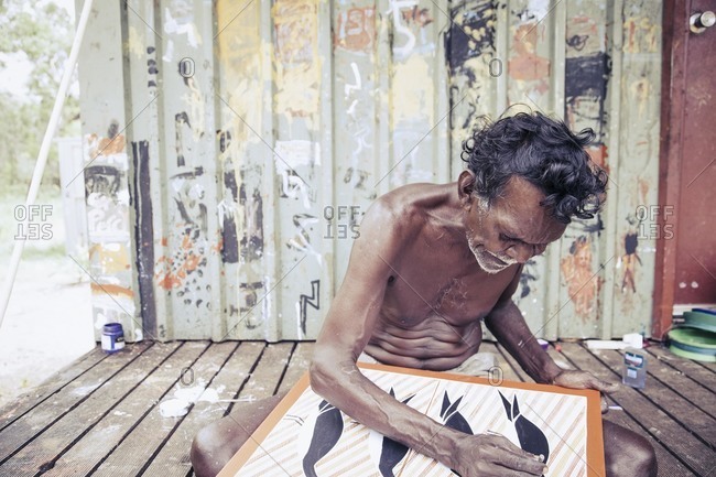 Elcho Island, Norther Territory, Australia - February 21, 2011: Male artist at work,