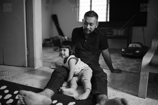 Man sitting with boy on the floor