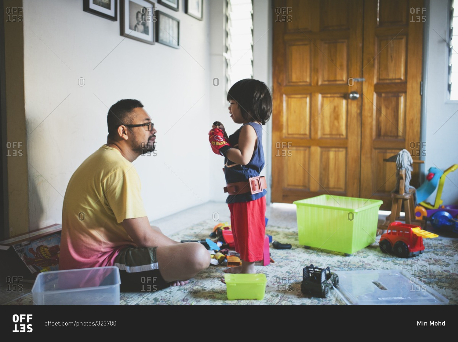 Dad and child playing in their house