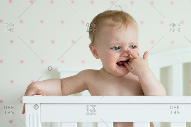 Baby Standing In A Crib Crying Stock Photo Offset