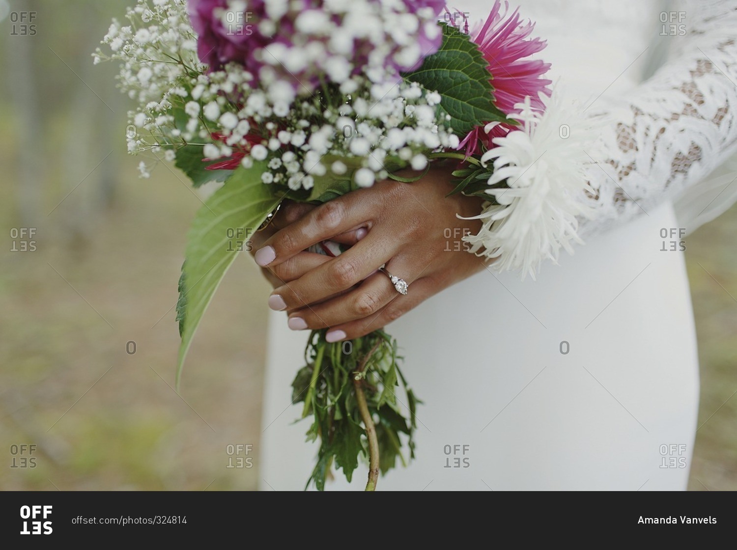 A floral bouquet in a bride's hands