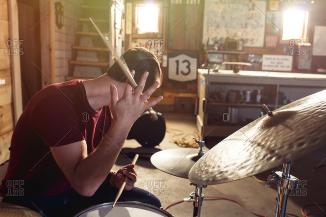 Teen boy at a drum set
