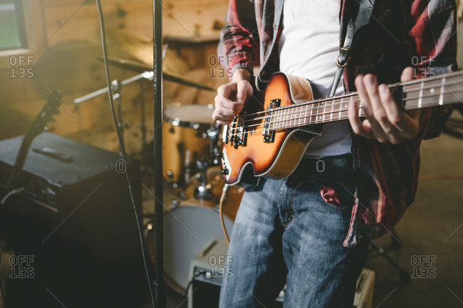 Teen playing an electric guitar