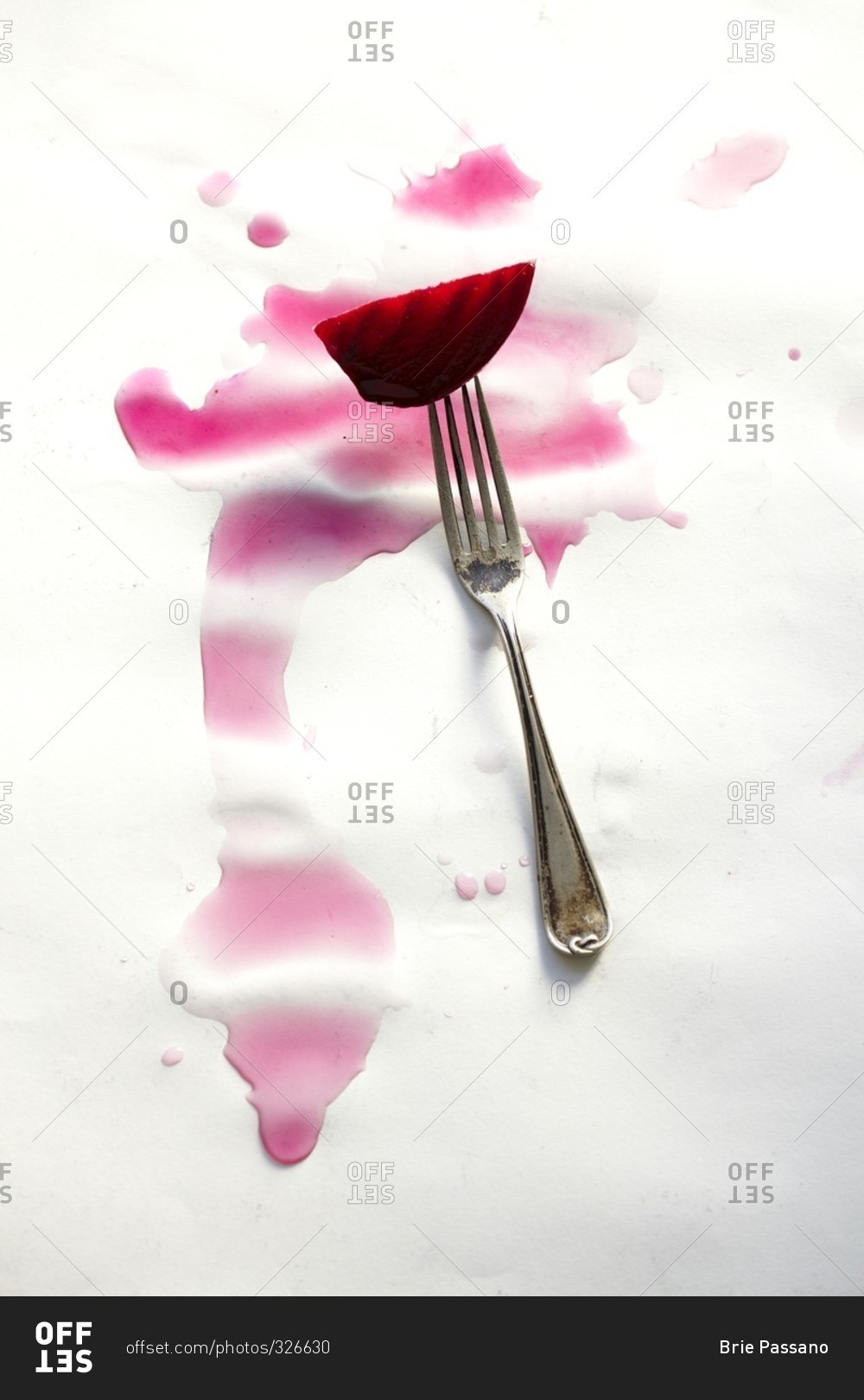Beet slice on a fork with beat juice