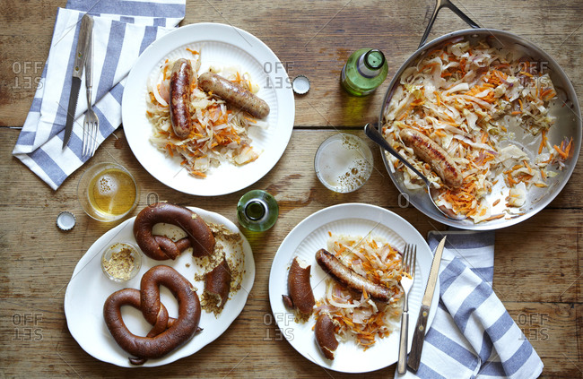 Sausage, sauerkraut, and soft pretzels served with beer
