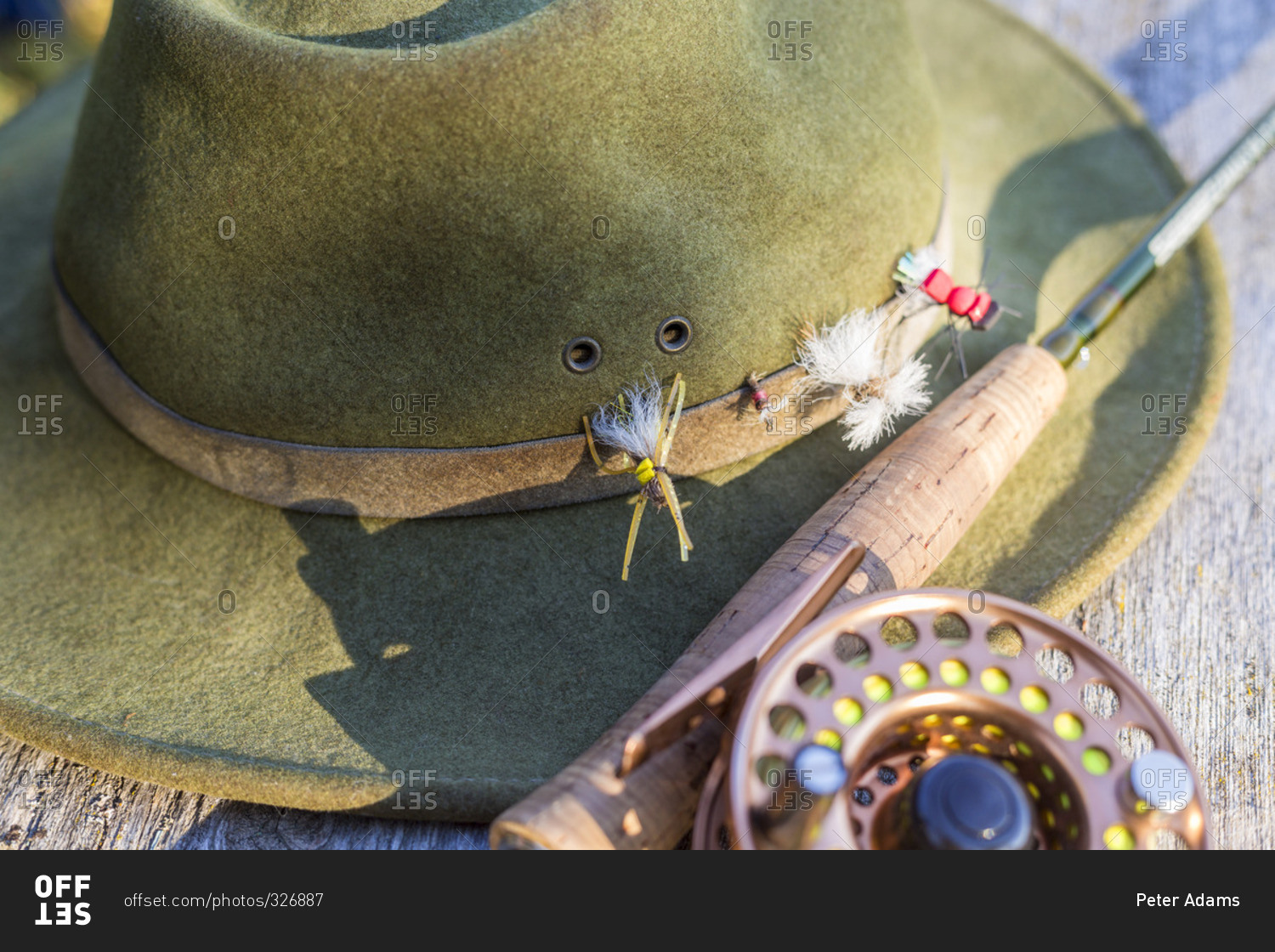 Fly fishing hat with flies and rod - Stock Image - Everypixel