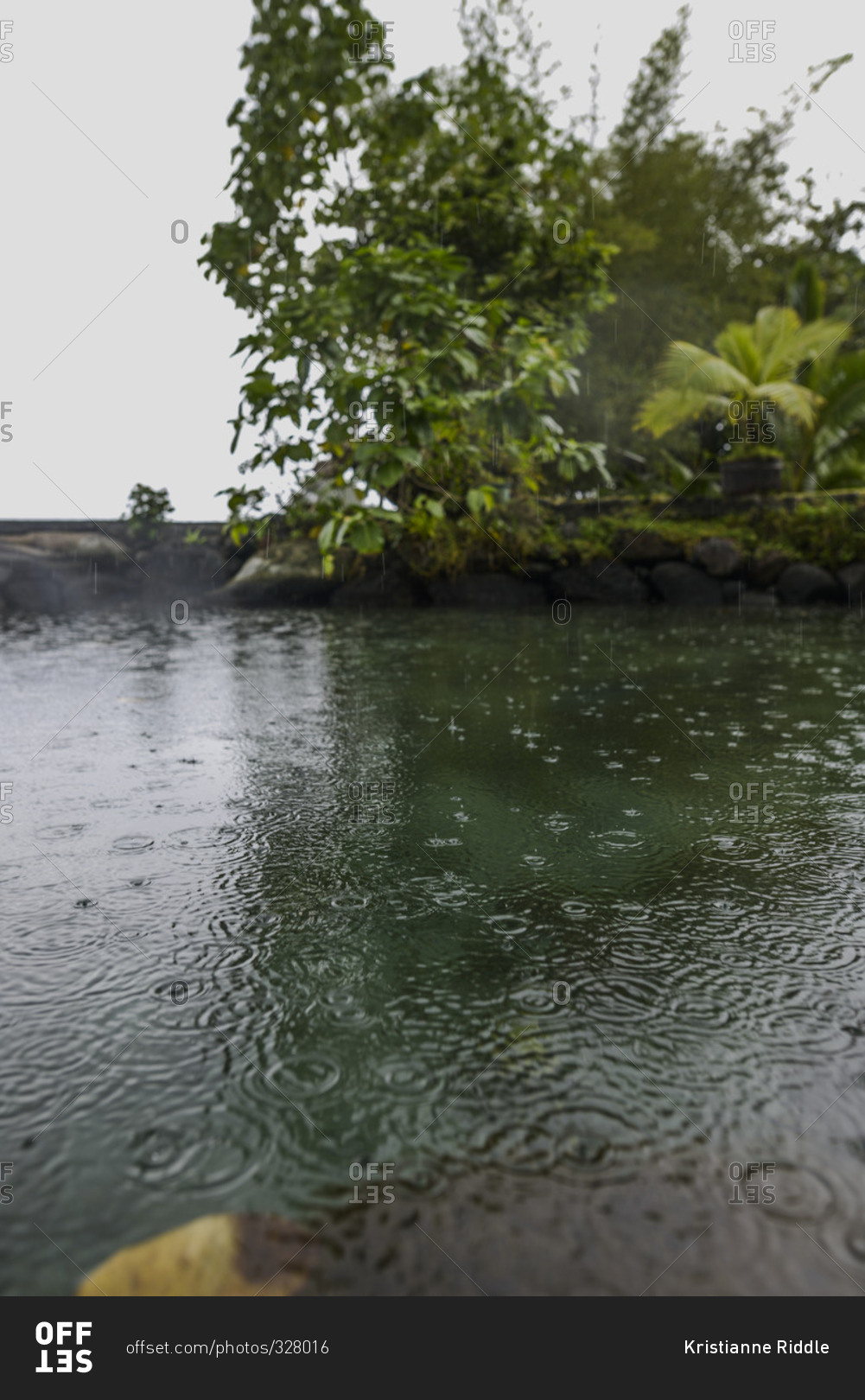 Rain drops splashing on the water's surface, Moorea, French Polynesia