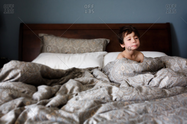 boy waking up from bed