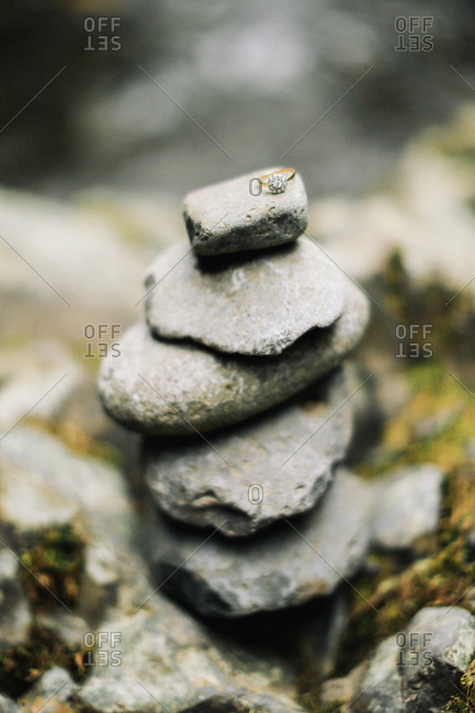 Diamond ring on top of a stack of stones