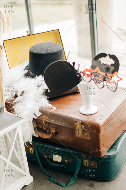 Vintage Suitcases With Costumes And Props For Wedding Reception