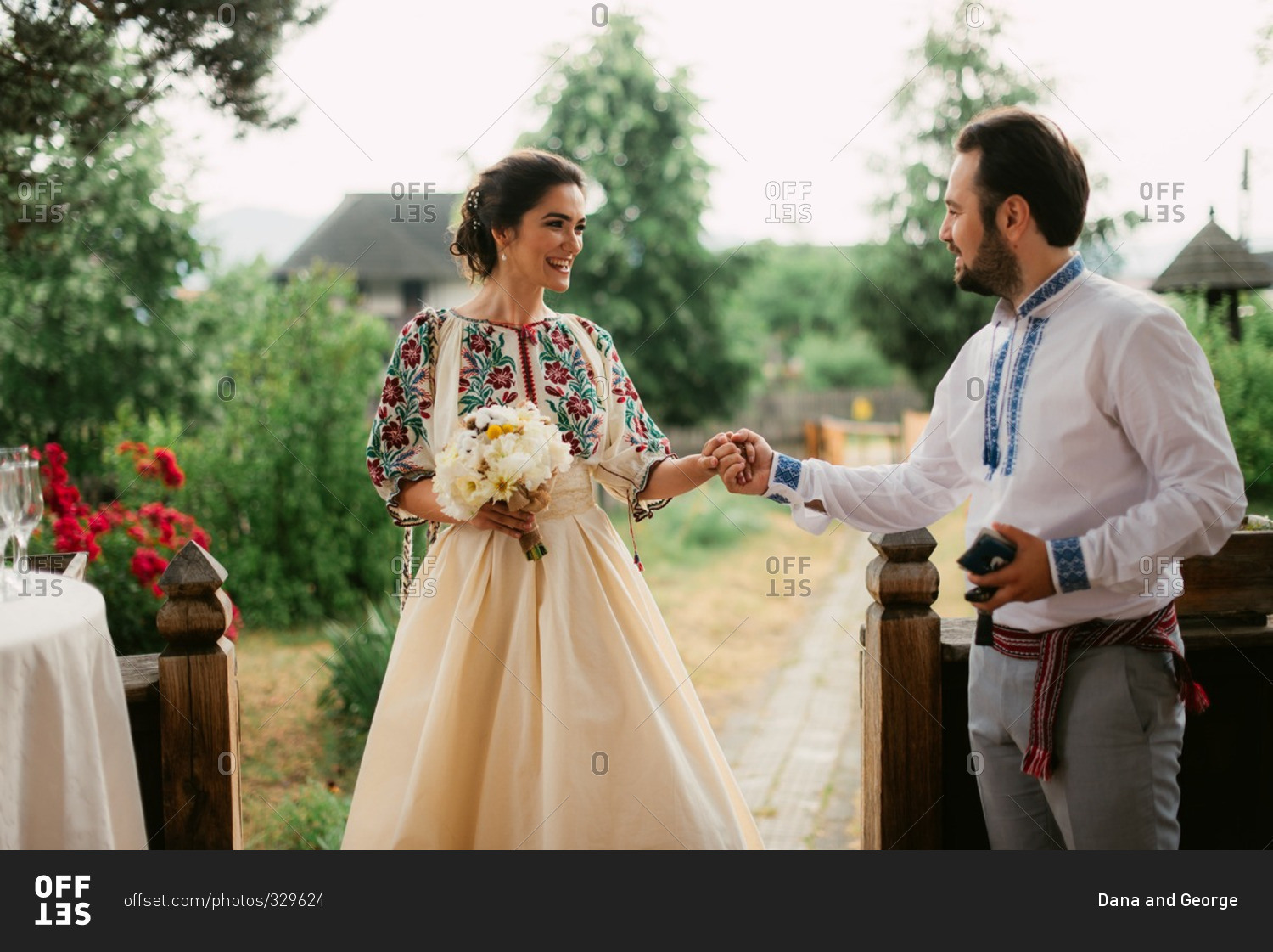 Romanian bride and groom in traditional dress at outdoor wedding stock ...