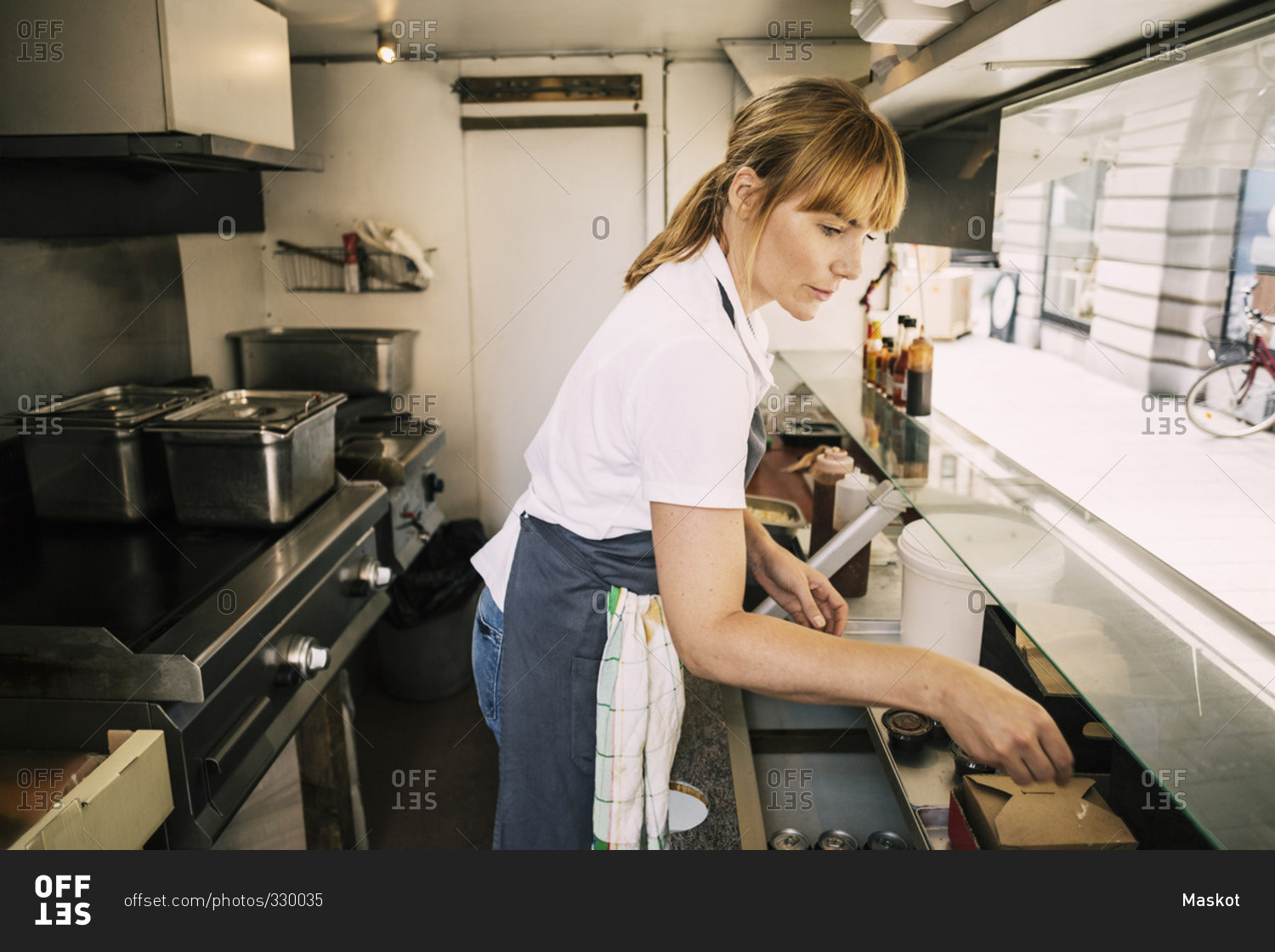 Woman working in food truck