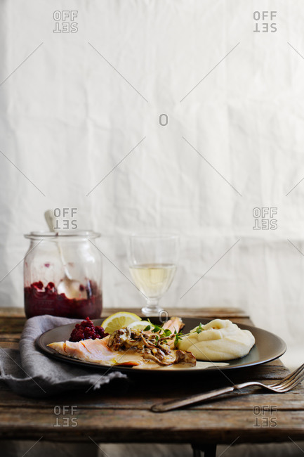 Char served with a creamy chanterelle sauce, mashed potatoes, and lingonberry jam