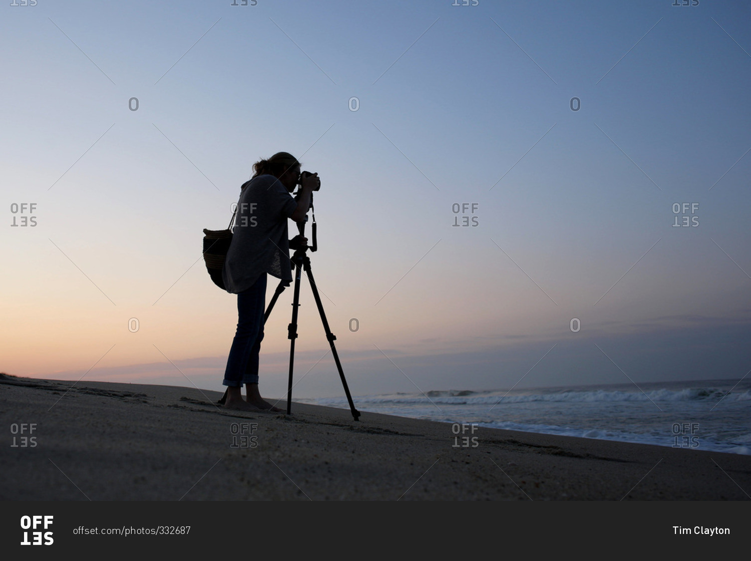Photographer taking picture of the ocean