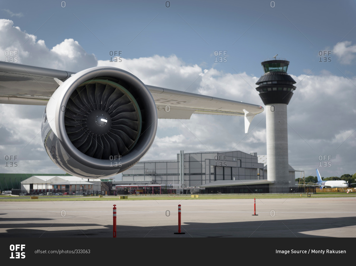 View of an jet engine and control tower at an airport