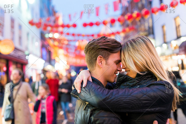 Romantic young couple hugging, Chinatown, London, England, UK