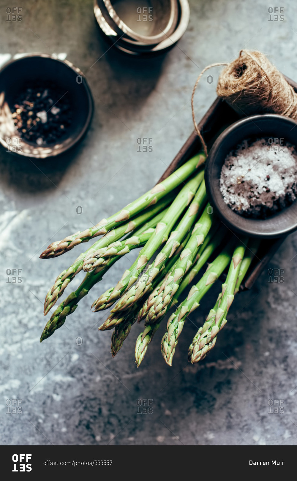 Fresh cut asparagus with sea salt and pepper stock photo OFFSET