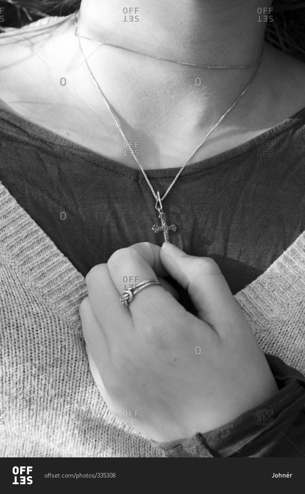 Girl holding heart shaped pendant