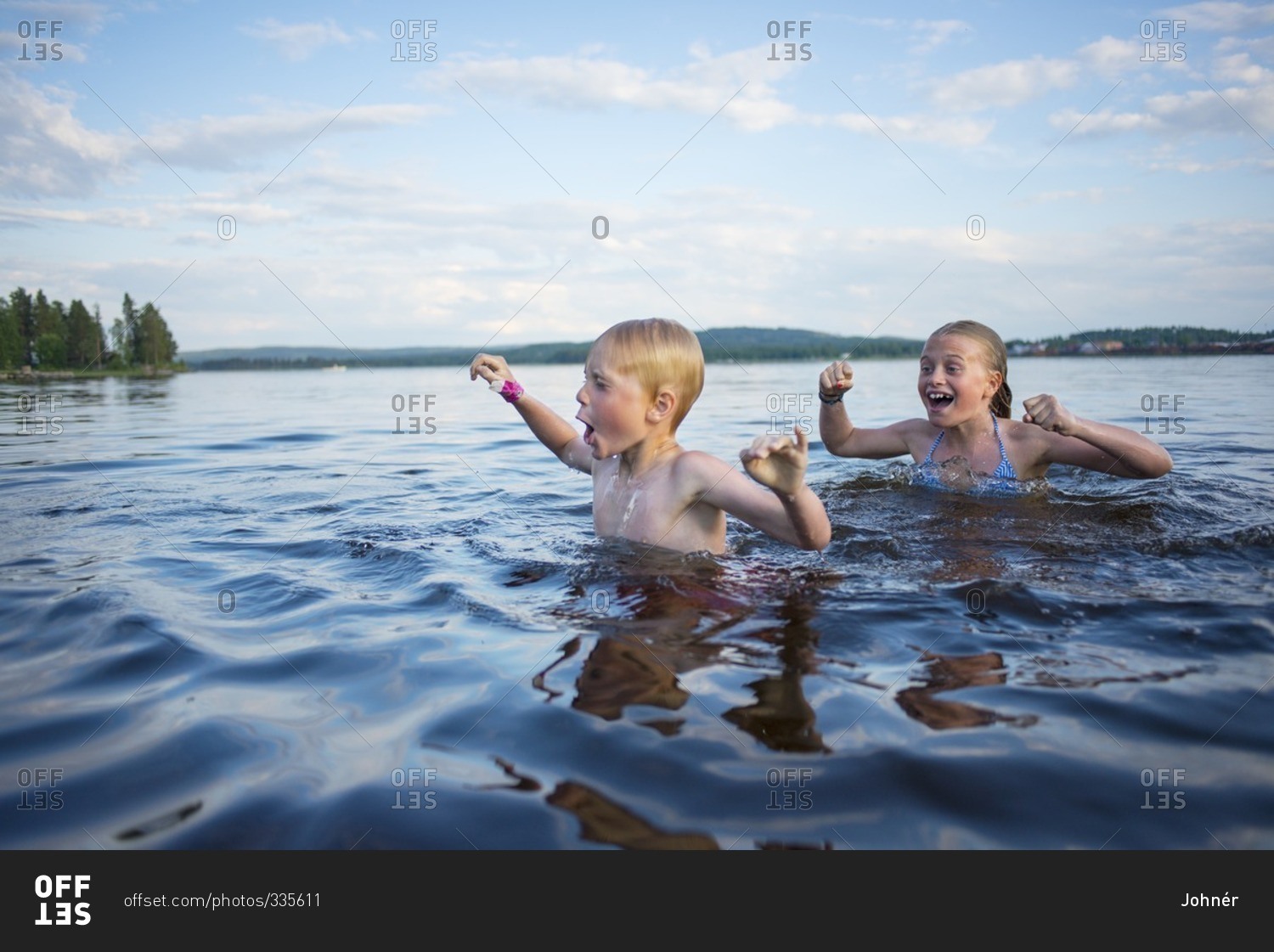 The children are swimming in the river